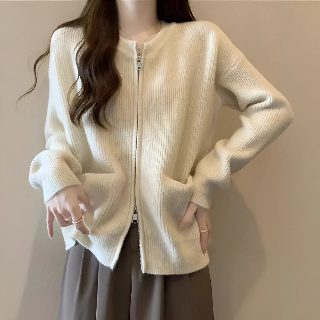 Beige women's long sleeve soft glutinous sweater coat cardigan laid flat.
