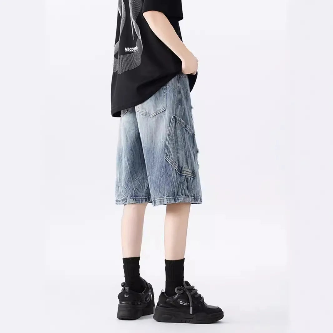 Women's washed denim shorts with ripped detailing in loose retro fit, shown in black and blue colour options