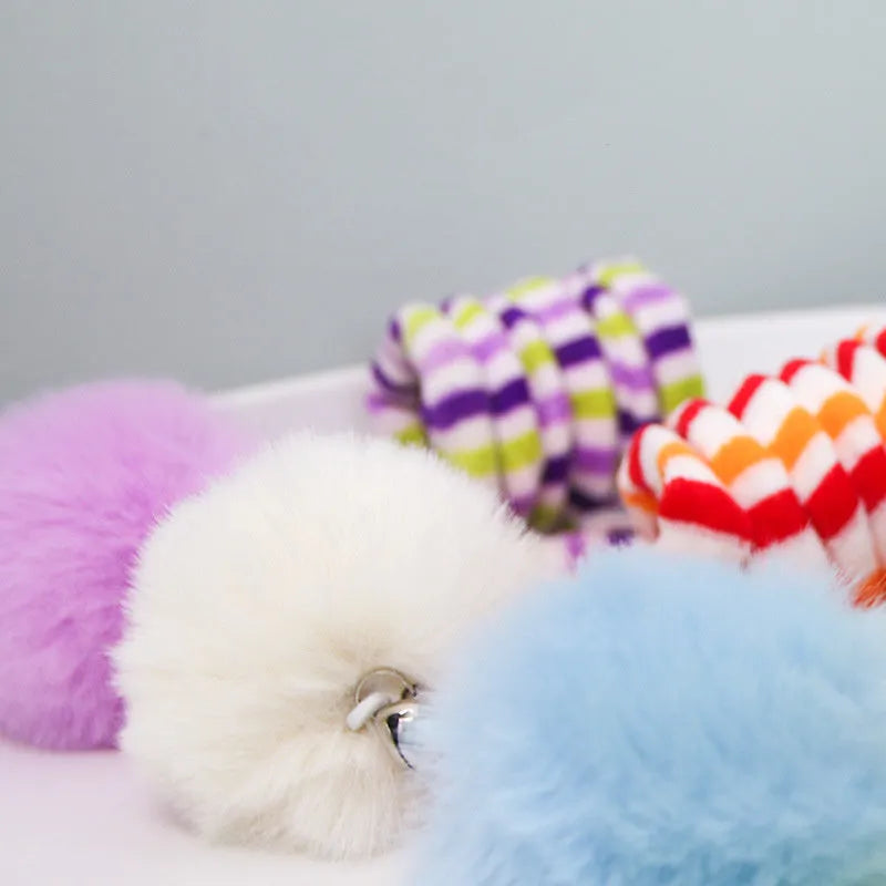 Hanging cat toy with long spring, inflatable ball, bell, and suction cup in various colours