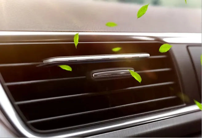 Car air-conditioning vent clip aromatherapy diffuser in black with floral scent, paddle design