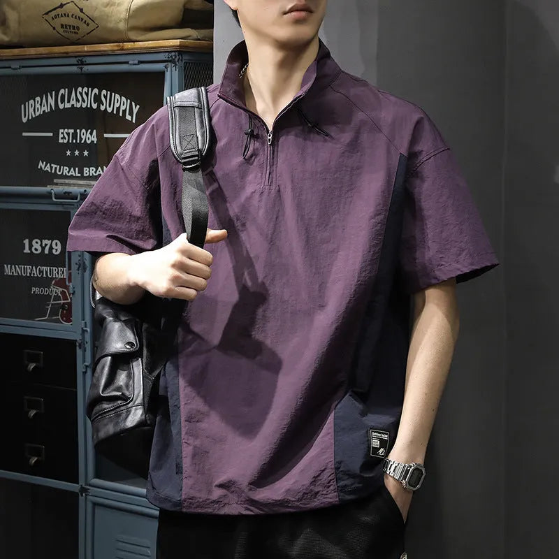 Brown men's casual half-zip short-sleeve shirt with a stand collar, showing the fleece-lined interior and loose fit.