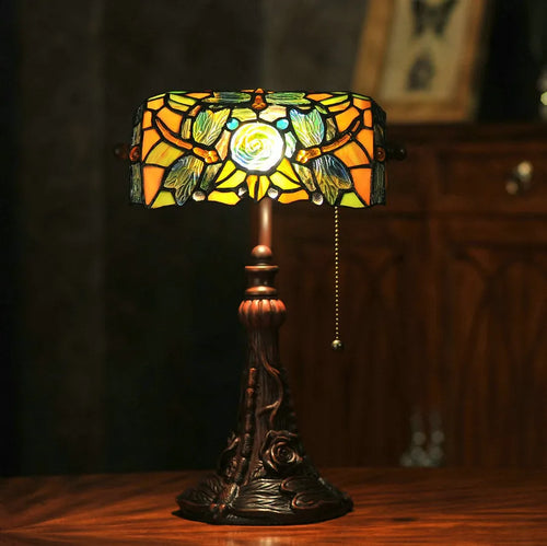 10-inch Tiffany stained glass table lamp with resin base on a wooden desk.