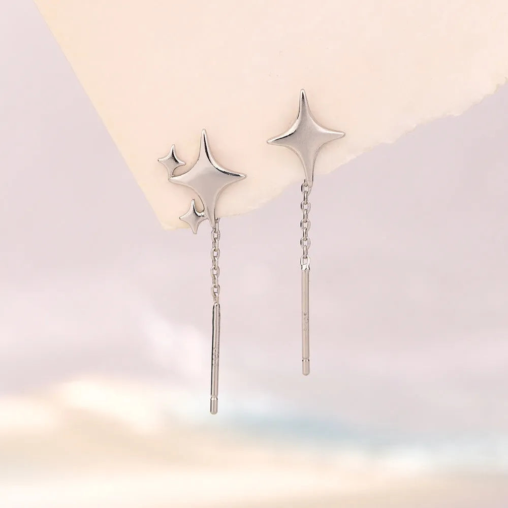 Asymmetric four eight-pointed stars hanging earrings in copper for women
