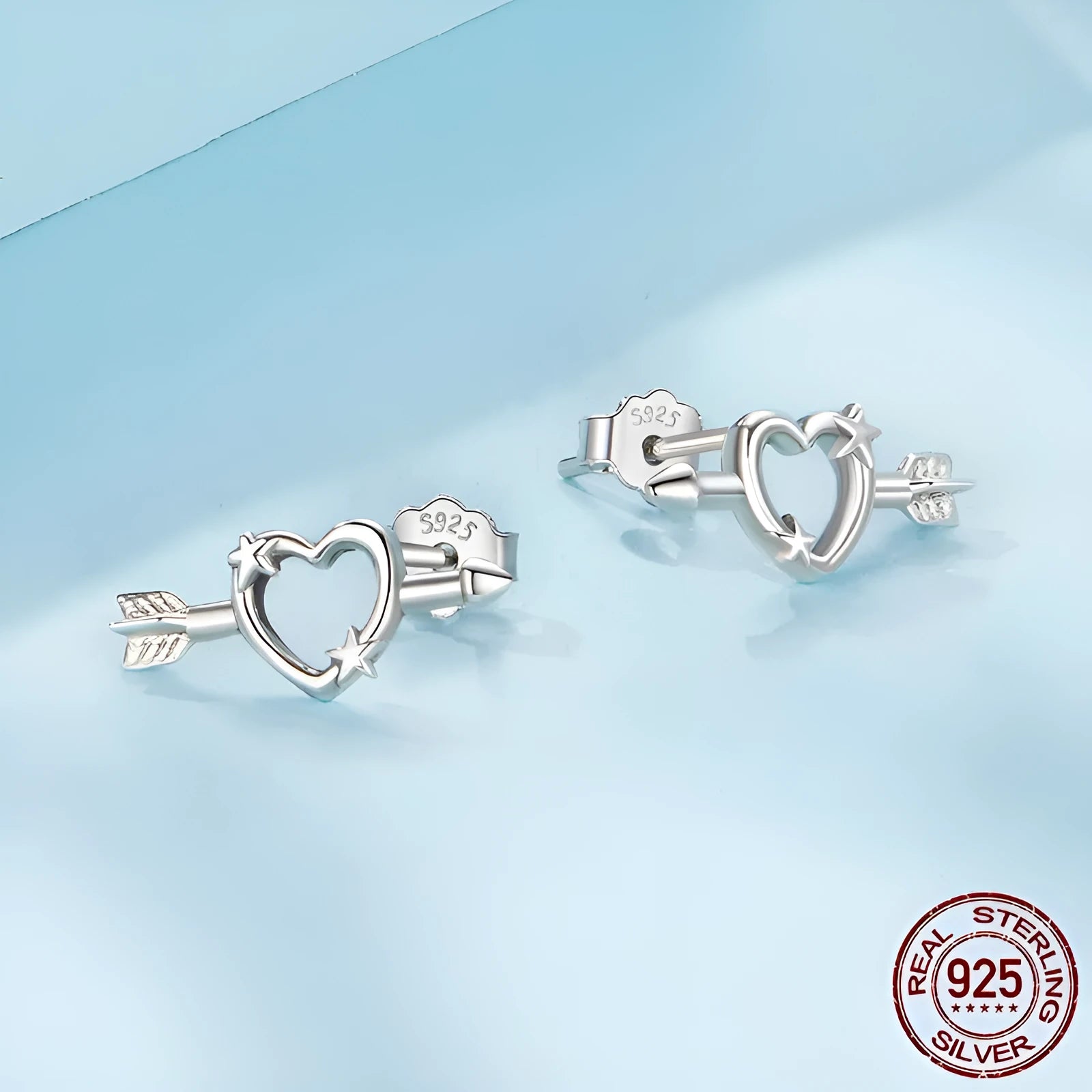 S925 sterling silver mini heart stud earrings with polished finish on white background
