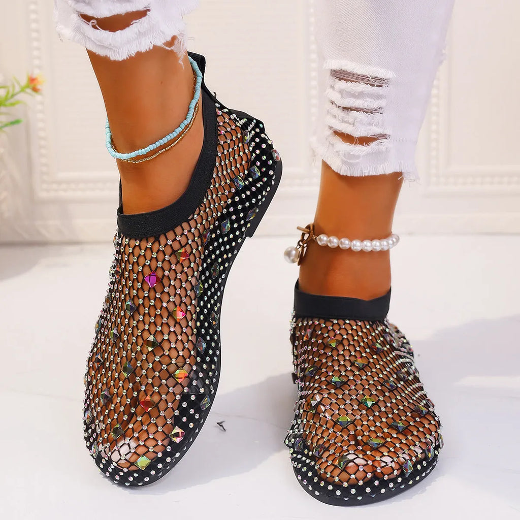 Women's colourful rhinestone flat sandals with mesh upper and rubber sole.