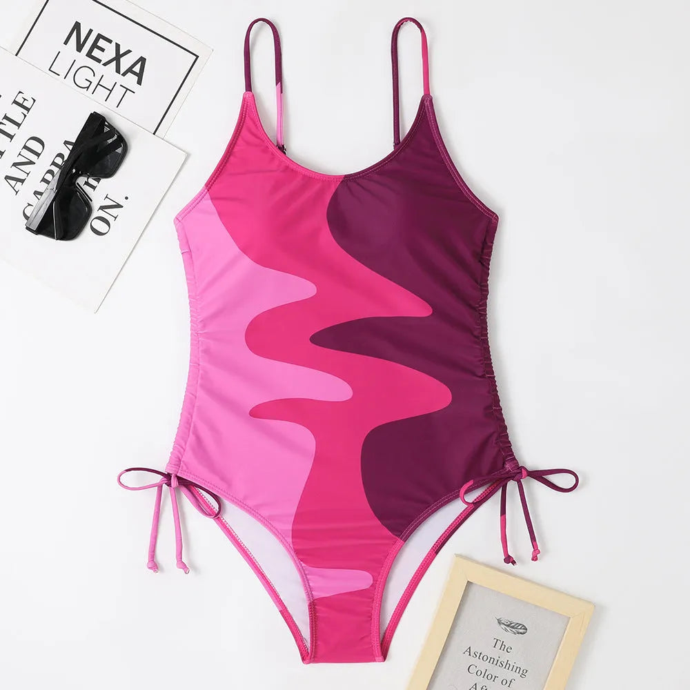 Women's blue sleeveless one-piece swimsuit with fixed trunks on a mannequin.