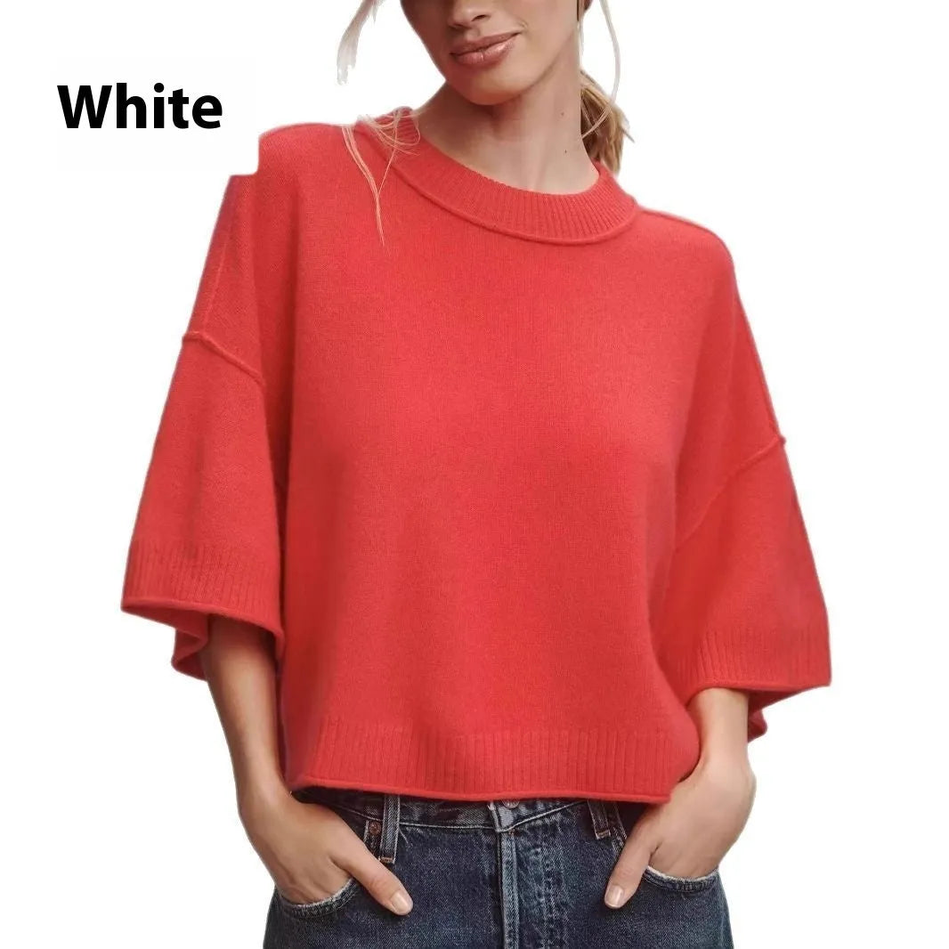 Red short sleeve viscose crop top with an exposed navel design on a model.