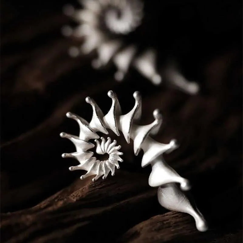 Conch colour stud earrings with three-dimensional matte finish and irregular contemporary design