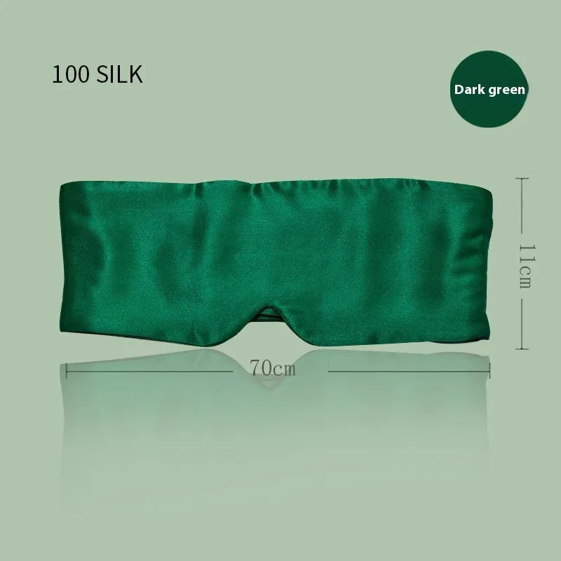 Mulberry silk sleep eye mask shown in champagne gold colour, laid flat on a surface.