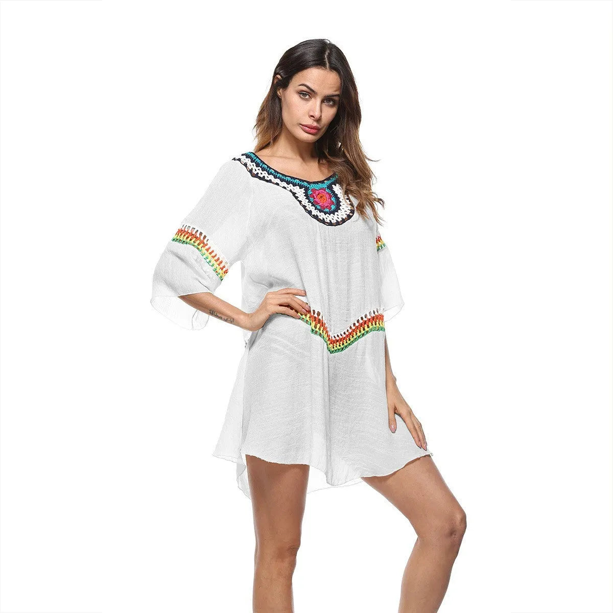 Women's crocheted ethnic style sun protection clothing in apricot colour with beach background