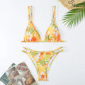 Women's printed halter bikini briefs swimming set in polyester fibre showing floral pattern and backless design
