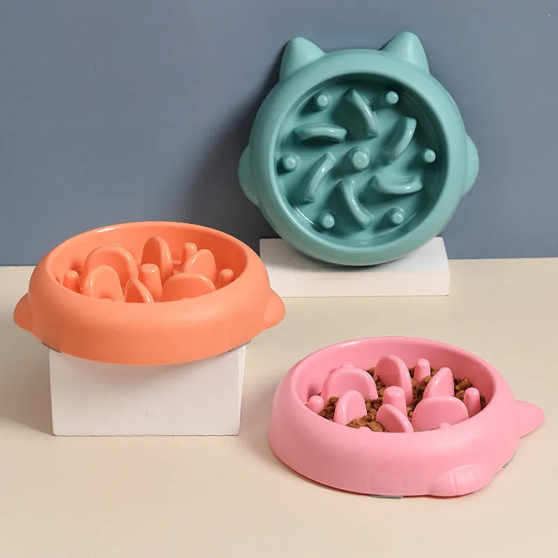 Green pet slow feeder bowl with bone-shaped ridges inside to slow down eating