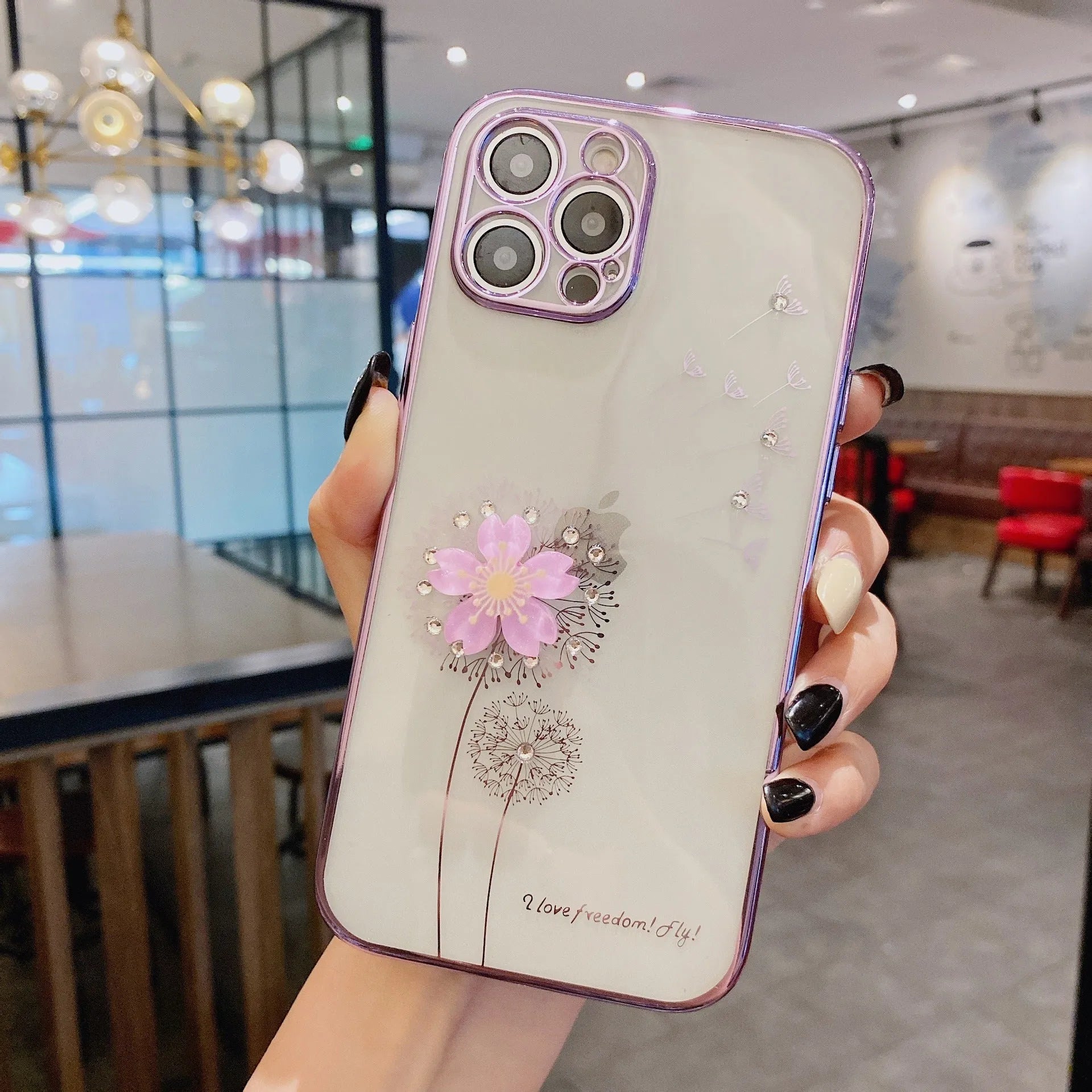 Green 3D floral patterned iPhone case with a silver rotating ring stand on the back.