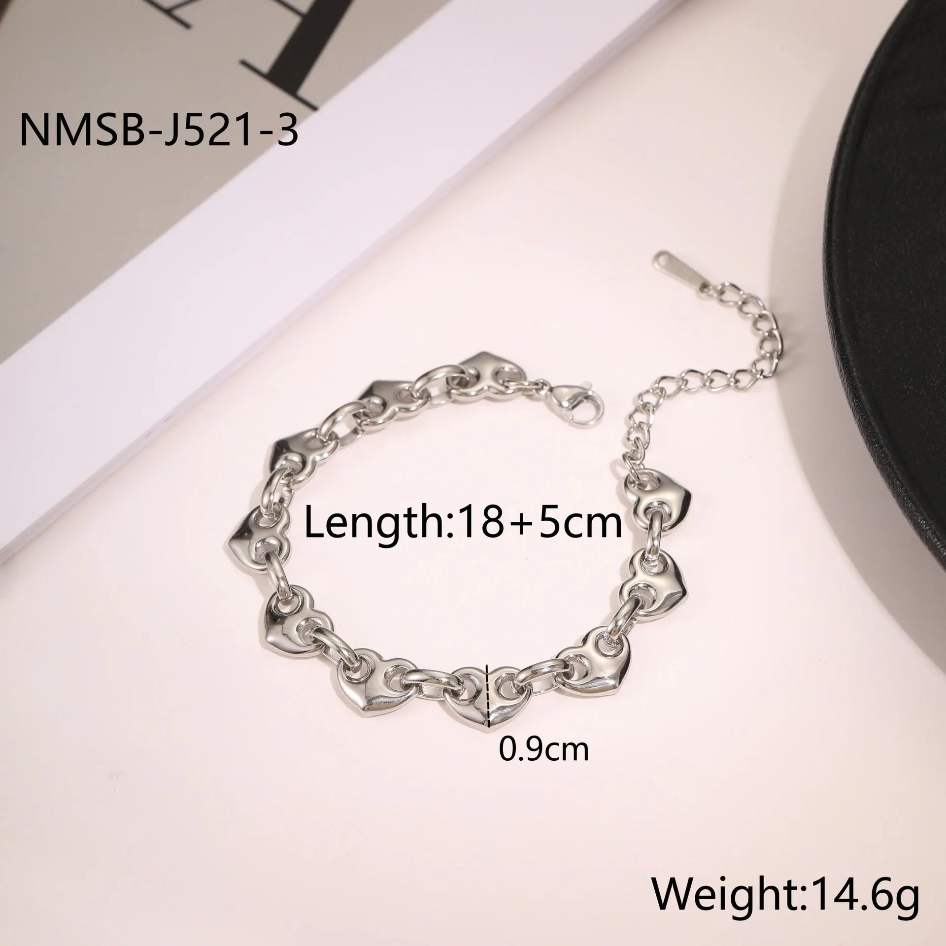 Stainless steel women's bracelet with a hollowed-out heart charm in gold or steel colour.