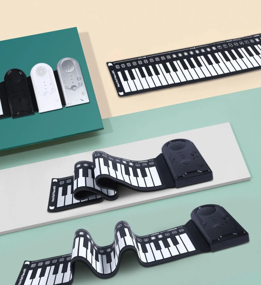 Portable folding 49-key electronic keyboard with speaker in compact rolled position showing silicone rubber keys and ABS plastic controls