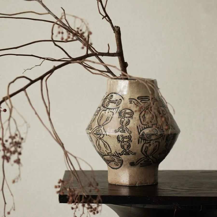 Hand-painted cylindrical ceramic vase with vintage carved tribal totem flower art.