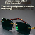 Dark green frameless crystal sunglasses with case and cleaning cloth