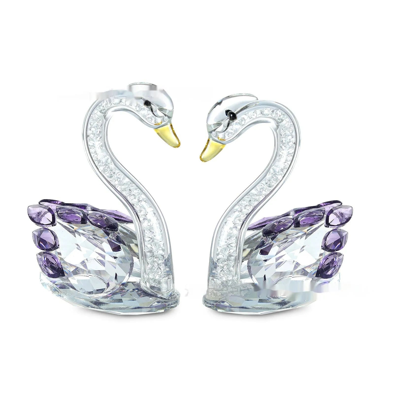 White crystal swan ornament on a desktop, shown in solid head and empty tube styles in red, blue, pink, and purple.