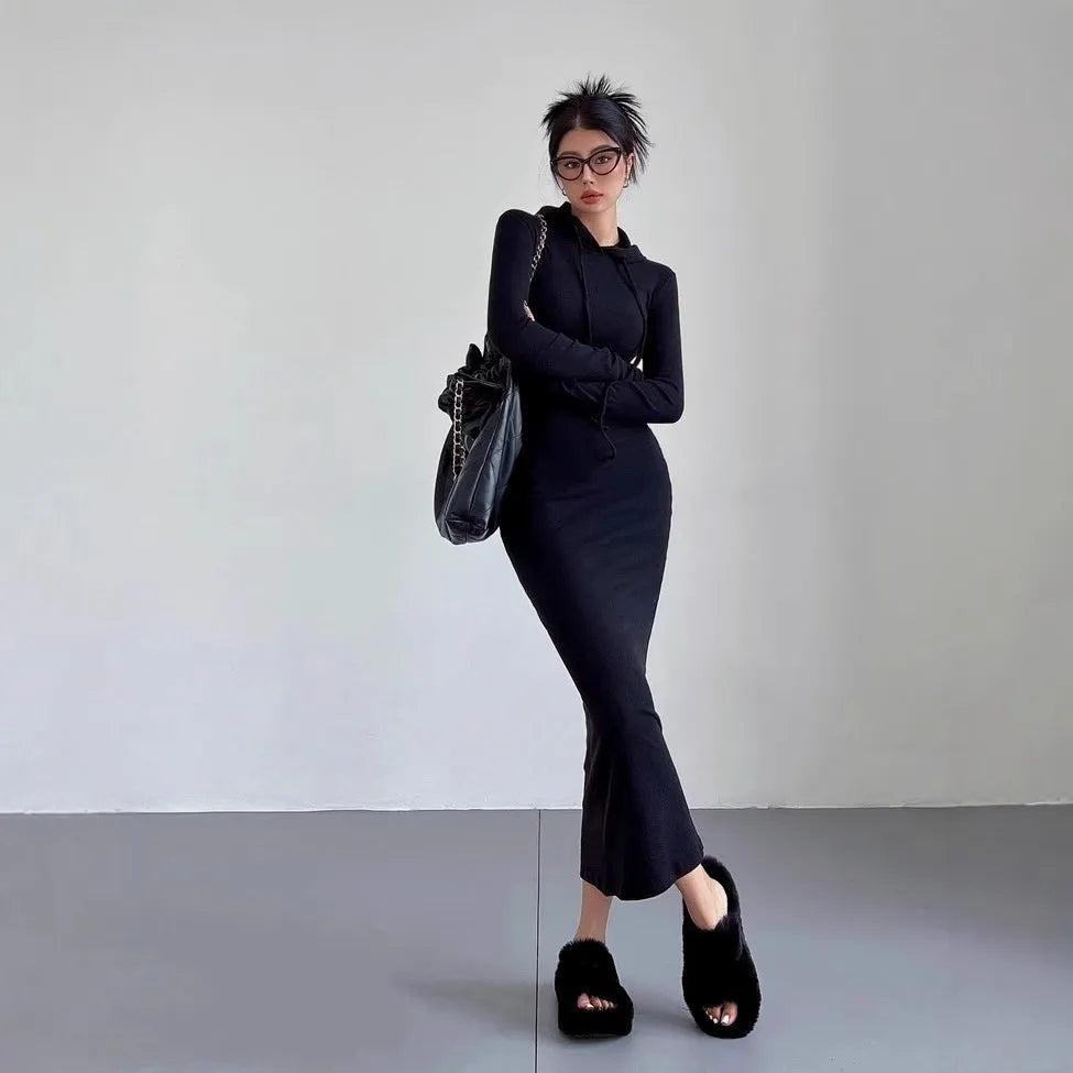 Women's grey hooded sheath dress with long sleeves and a high waist.
