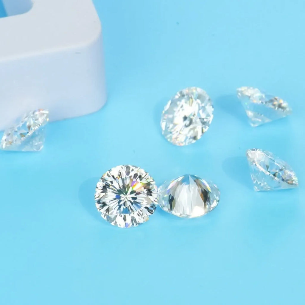 Round loose moissanite gemstone with eight hearts and eight arrows cut on a grey background.