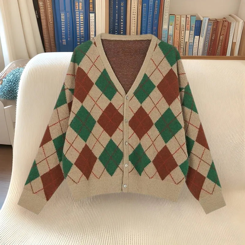 Casual knitted cardigan in acrylic fabric shown in a macaron colour palette on a hanger.