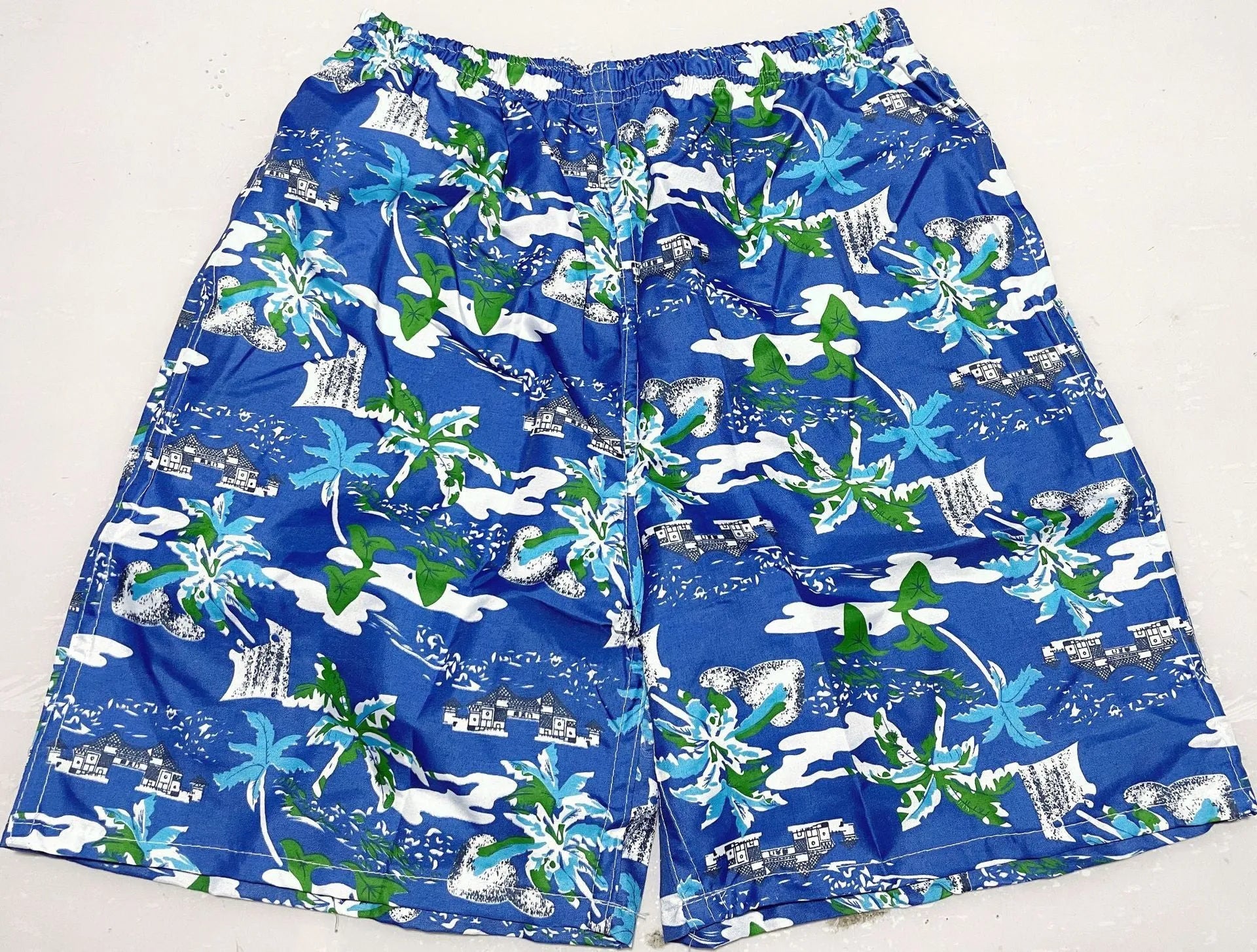 Men's floral print five-point swimming trunks in polyester, showing one of 24 available colour patterns.