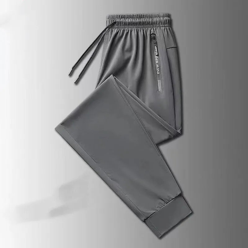 Men's loose fit thin ice silk polyester trousers in black leg style for autumn casual wear