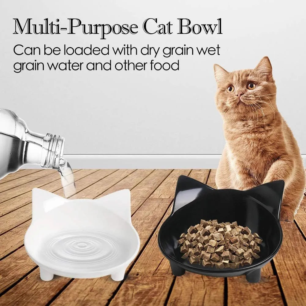 White shallow melamine pet bowl with non-slip black rubber base on a wooden floor.