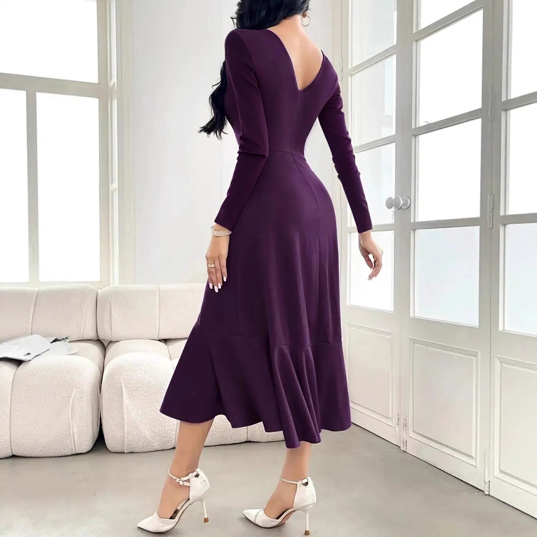 Purple women's long sleeve dress with round neck, ruffles, and mid-waist design on hanger