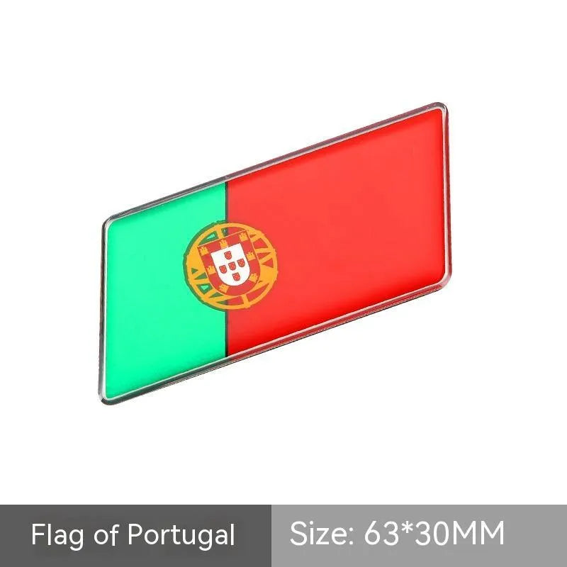 Aluminium parallelogram car sticker showing a national flag design, measuring 6.3 by 3 centimetres.