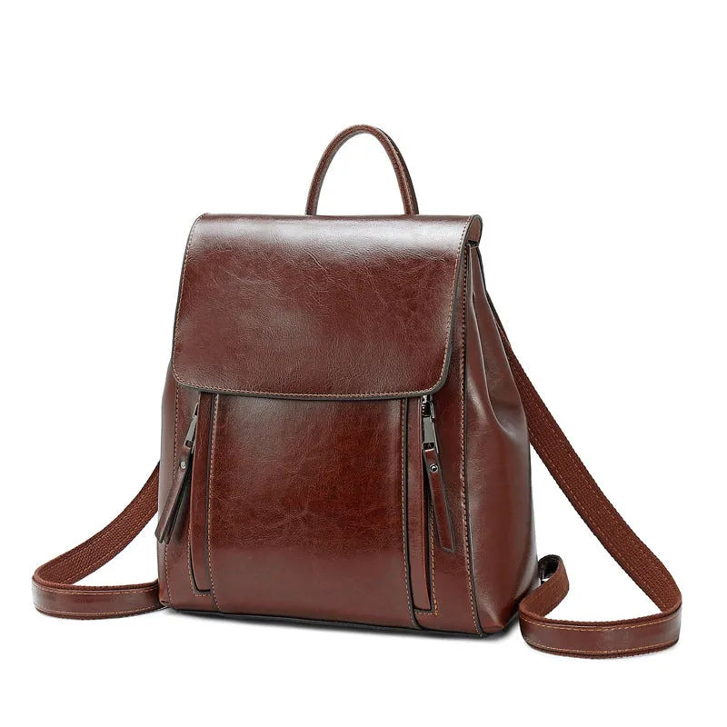 Genuine leather women's backpack in oil-wax cowhide with multiple internal pockets and compartments