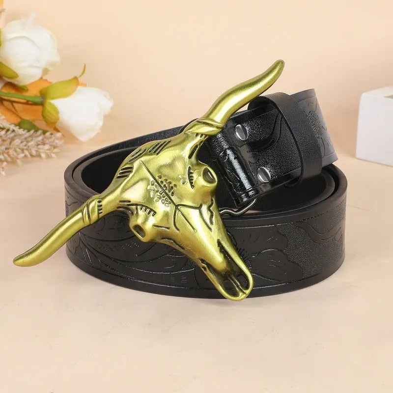 Cow head buckle men's imitation leather belt in black and brown colour options showing decorative alloy buckle detail