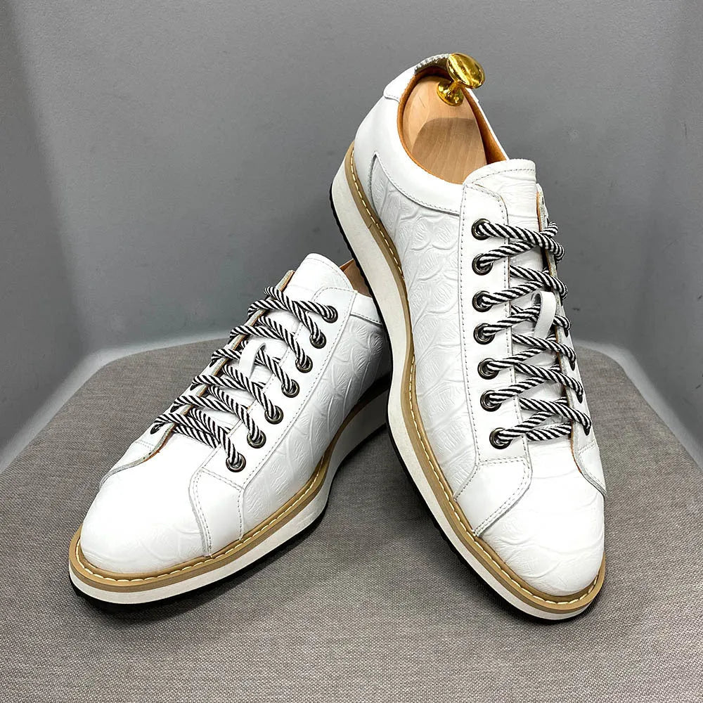 Men's low-top handmade casual shoes with an embossed pattern and front lace closure.