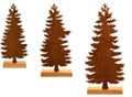 Set of three rusty iron elk and Christmas tree metal ornaments on a wooden surface.
