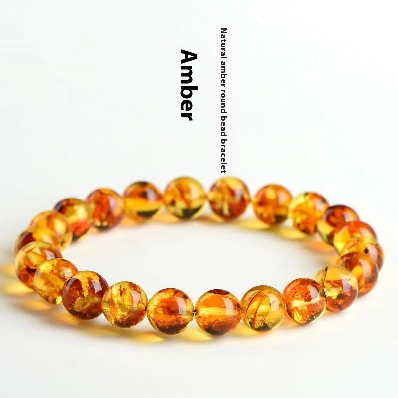 Natural yellow piebald amber bracelet with polished geometry beads and flower spot patterns