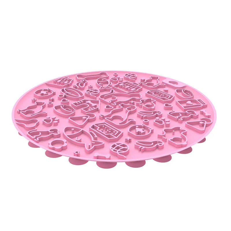 A blue silicone pet licking mat with a suction cup base on a kitchen floor.