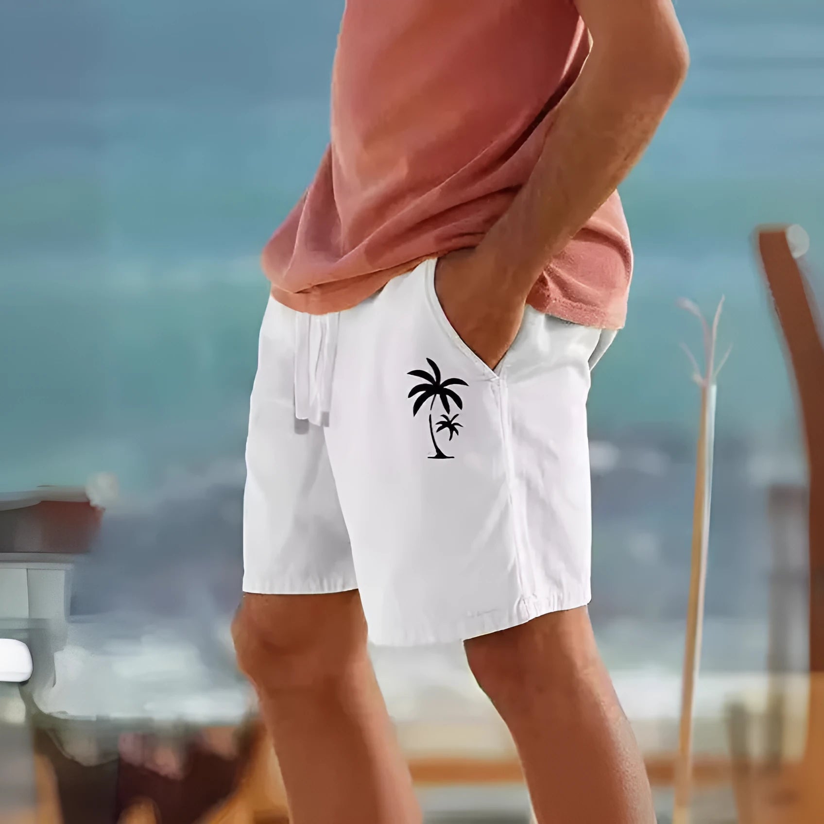 Man wearing Army Green elastic drawstring shorts with a heat transfer patch design, showing the straight leg cut.