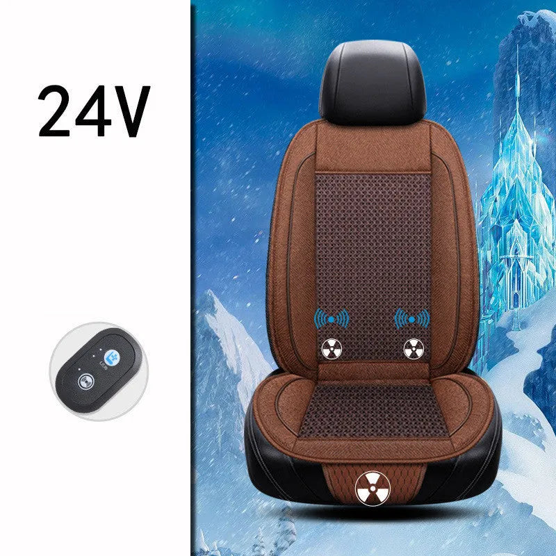 Square black car ventilation seat cushion on a car seat with a connected power cord.