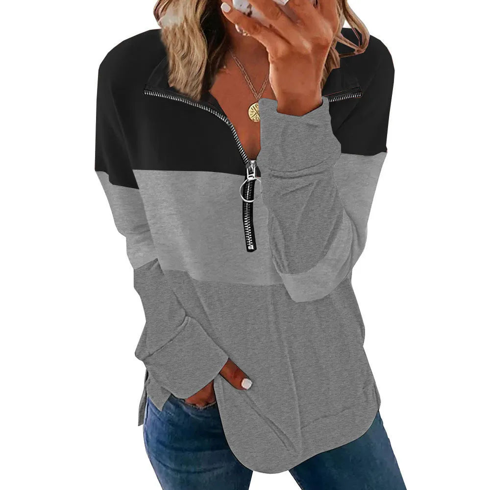A woman modelling a loose-fitting long-sleeved leopard print sweater in a casual setting.