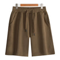 Straight-leg cotton sports shorts in light grey on a neutral background.