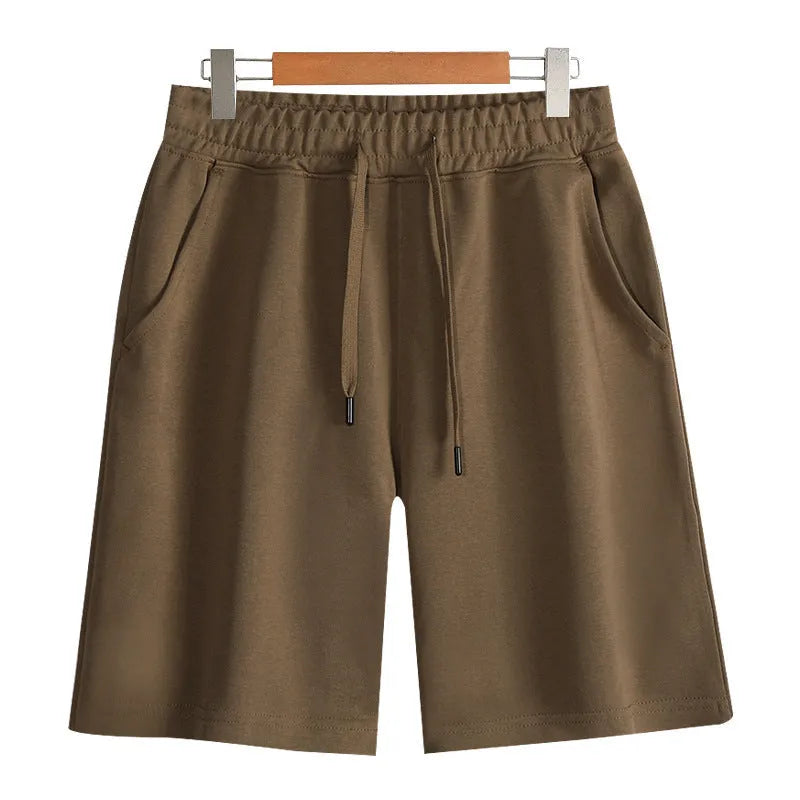 Straight-leg cotton sports shorts in light grey on a neutral background.