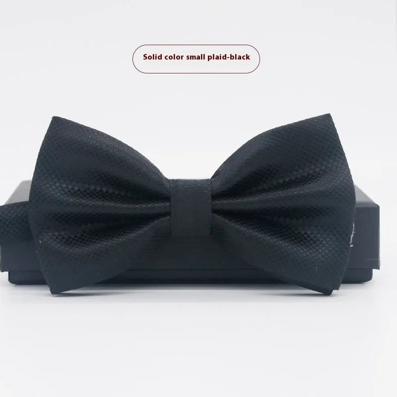 Solid colour flat head bow tie for formal wear in multiple colours including black, red, and blue.