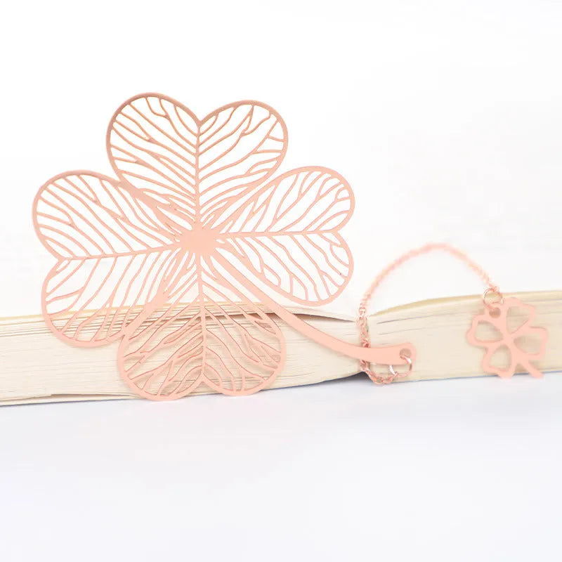 Brass bookmark with hollow-cut leaf design and matching rose gold metal tassel