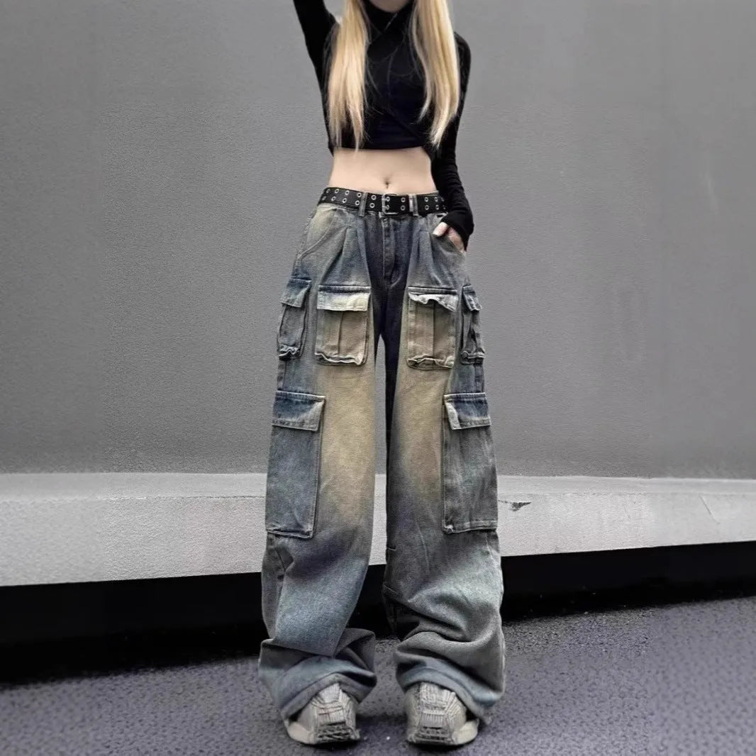 Loose fit distressed denim jeans with multiple pockets in light blue wash