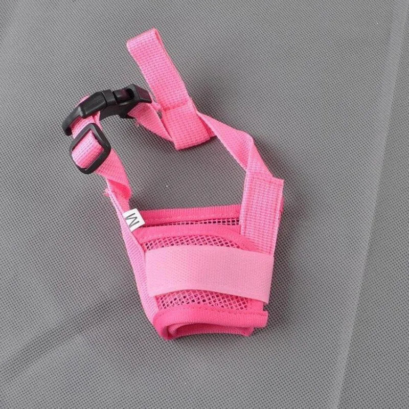Adjustable plastic dog safety muzzle in black, shown on a size chart.