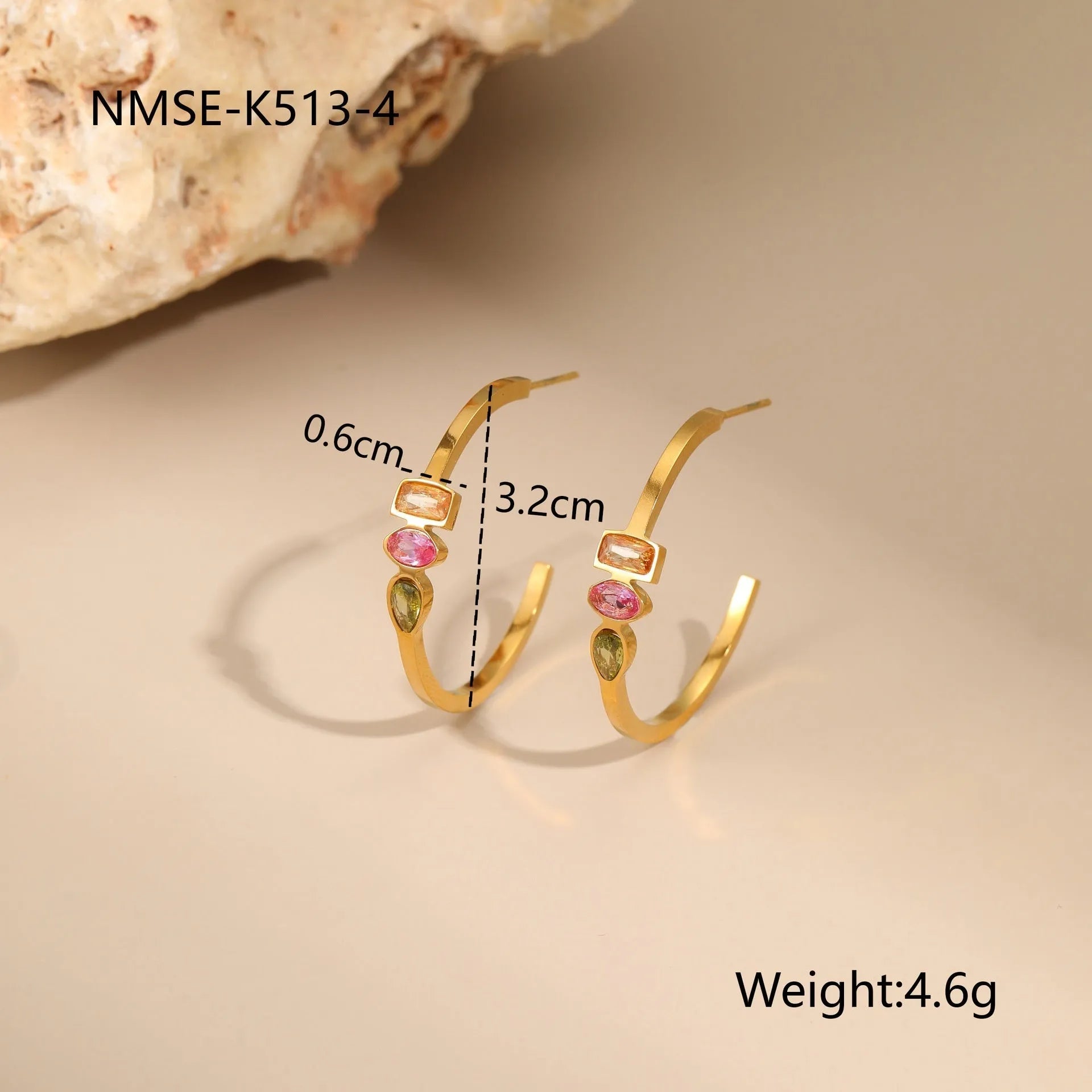 Geometric gold plated jewellery set showing necklace, ring, and earrings with chain design elements
