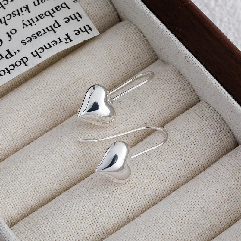 Three-dimensional glossy heart-shaped earrings with Korean style design and silver colour finish
