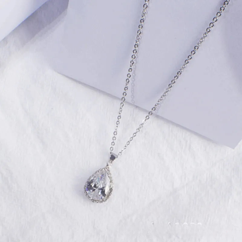 Rose gold geometric drop necklace with rhinestone details in pink colour option