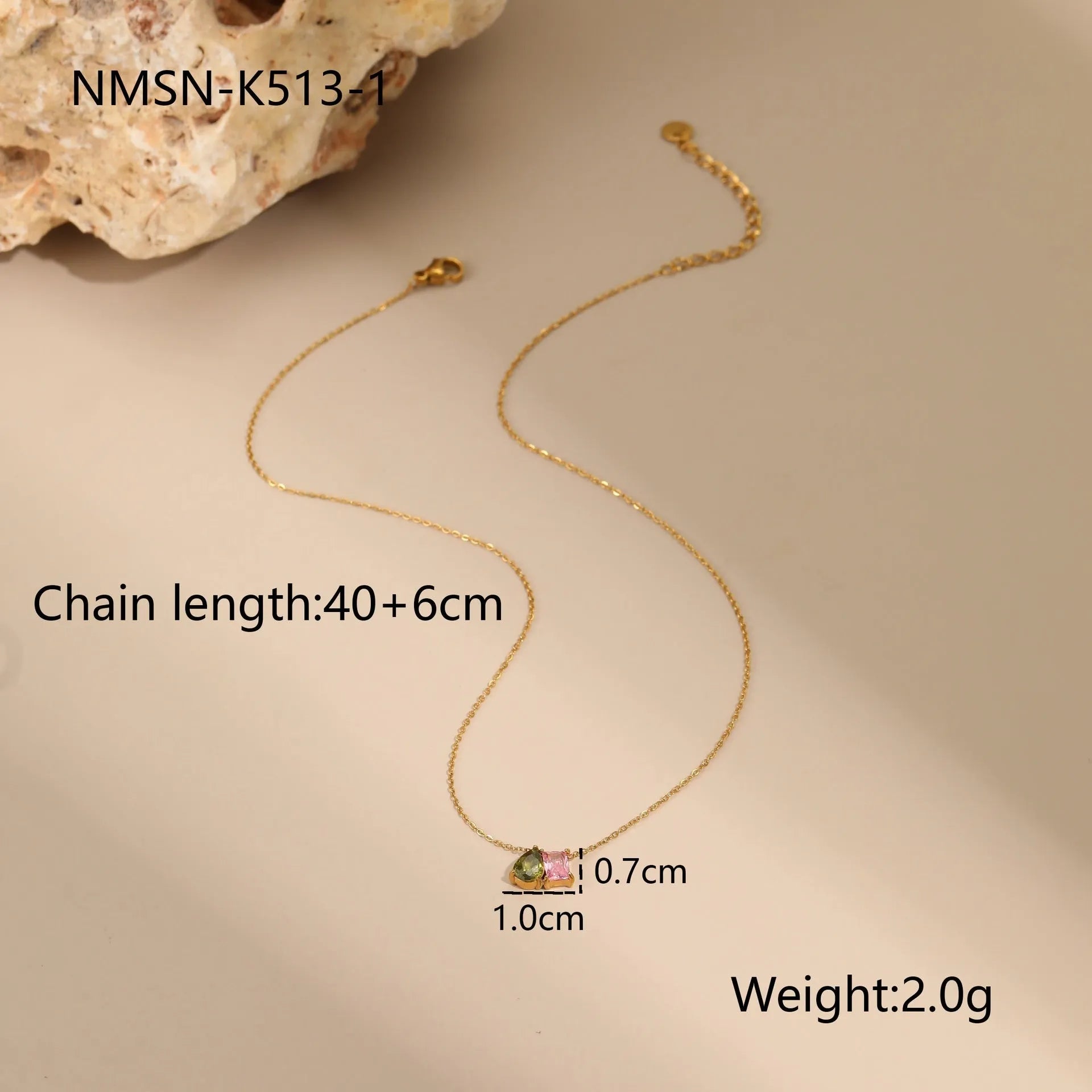 Geometric gold plated jewellery set showing necklace, ring, and earrings with chain design elements
