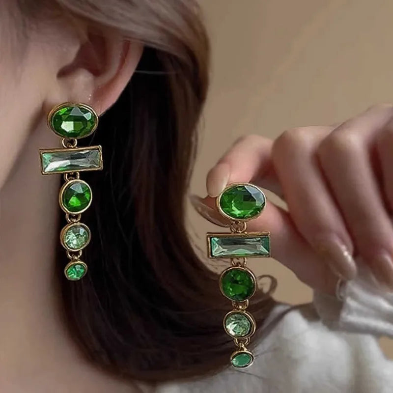 A pair of geometric Chinese style alloy earrings with a retro green gradient finish and zircon-inlaid tassels.